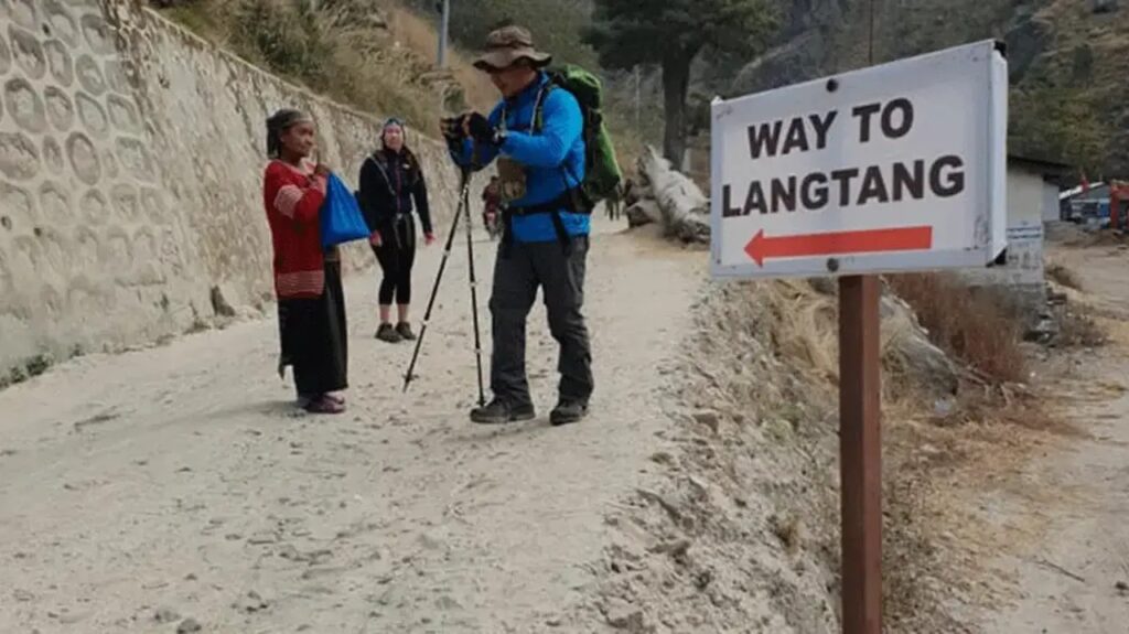 Way to Langtang Valley Signboard with Trekkers